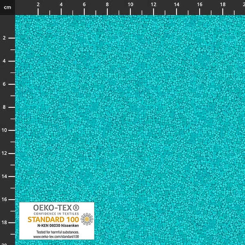 Stof Brighton cotton blender quilting fabric in turquoise with a ruler