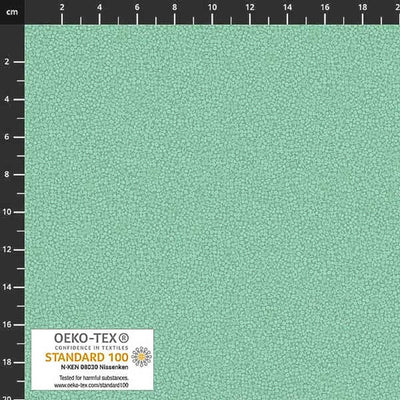 Stof Brighton cotton blender quilting fabric in mist green with a ruler