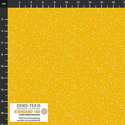 Stof Brighton cotton blender quilting fabric in golden yellow with a ruler