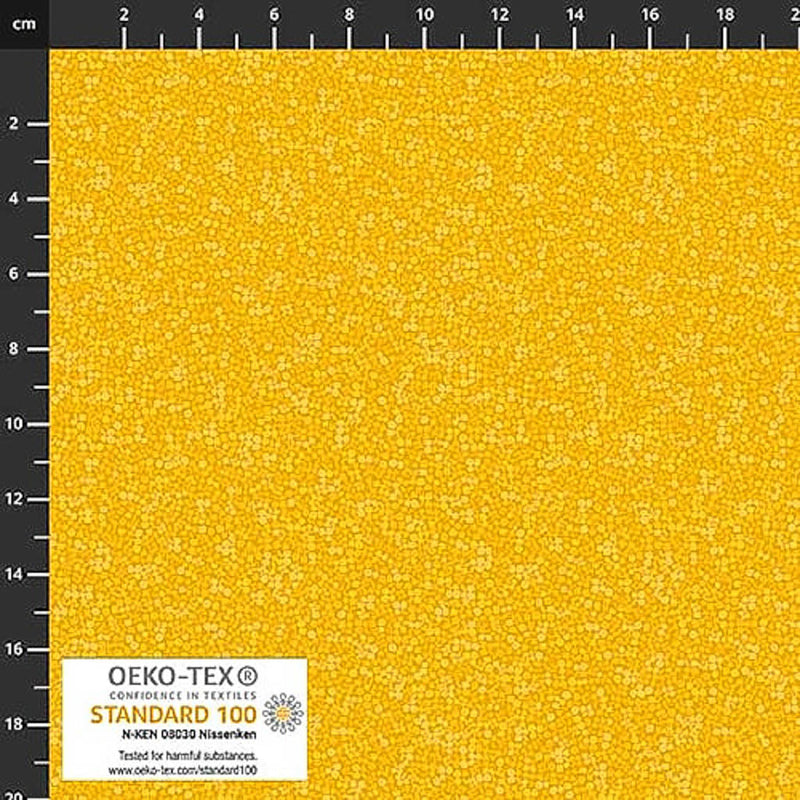 Stof Brighton cotton blender quilting fabric in golden yellow with a ruler