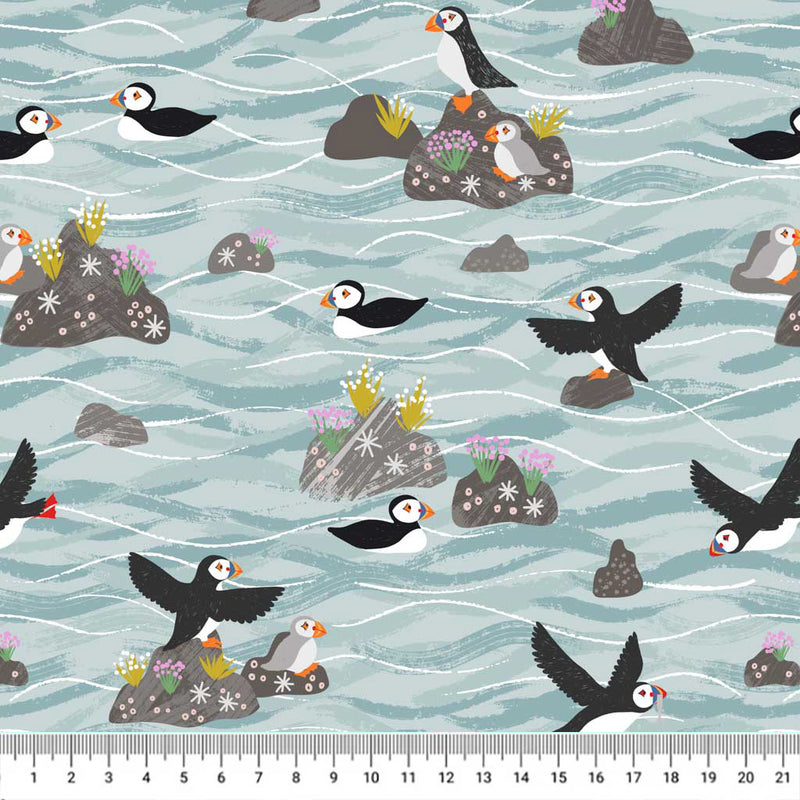 Puffins on rocks printed on a cotton quilting fabric