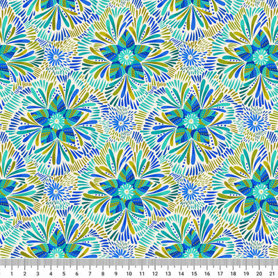 Blue and green star flowers are printed on a cream quilting fabric with a cm ruler