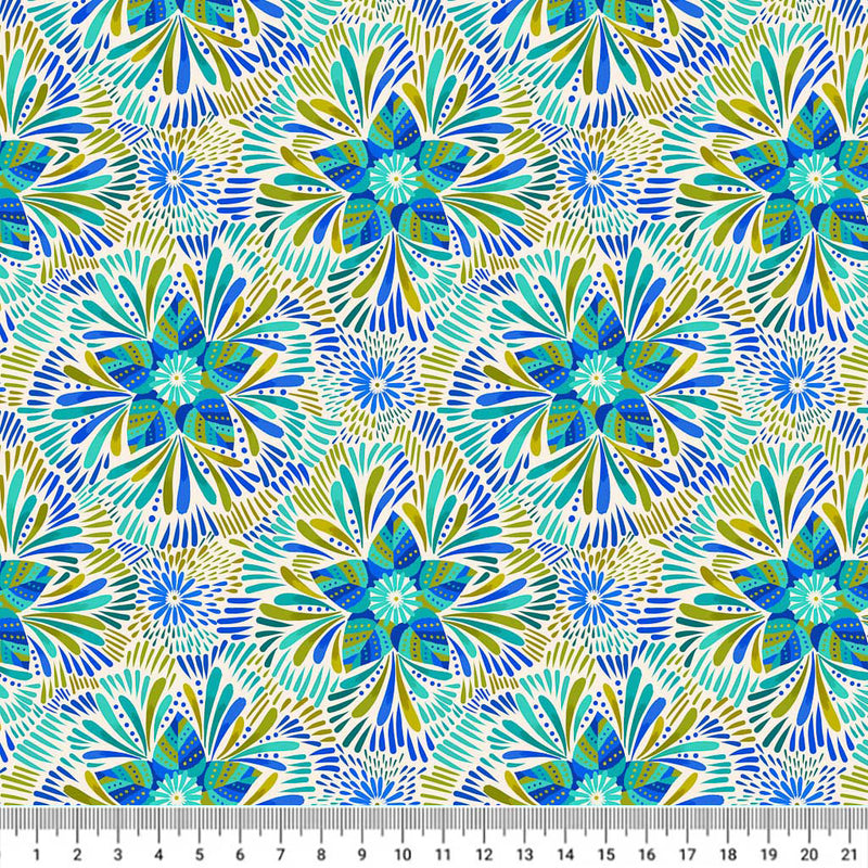 Blue and green star flowers are printed on a cream quilting fabric with a cm ruler