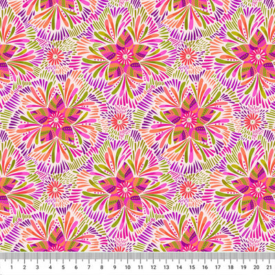 Pink and green star flowers are printed on a cream quilting fabric with a cm ruler