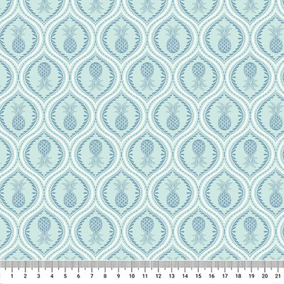 Gorgeous pineapples in mandala-like tear drops of navy are printed on a light lagoon blue quilting cotton.