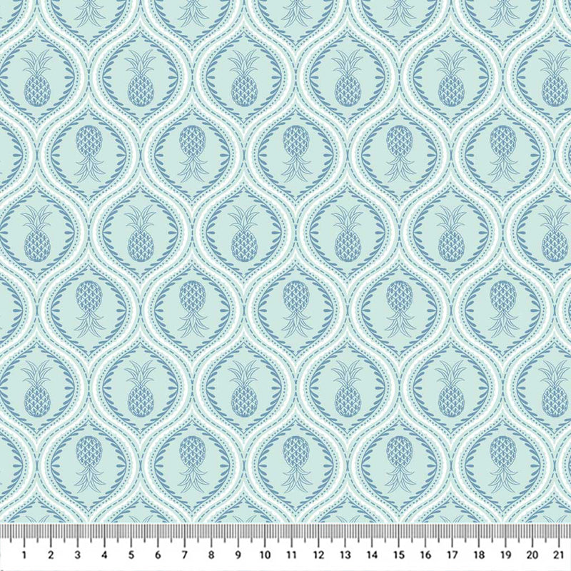 Gorgeous pineapples in mandala-like tear drops of navy are printed on a light lagoon blue quilting cotton.