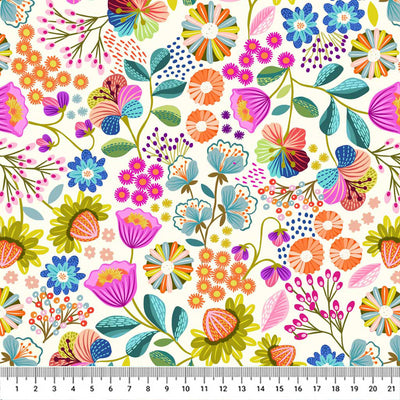 Bright flowers printed on a cream quilting cotton with a cm ruler