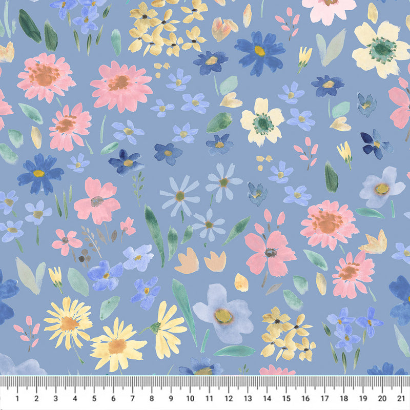 Hand-printed wild summer flowers printed on a cornflower blue quilting fabric with a cm ruler