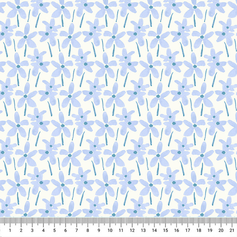 Hand-printed cornflower blue summer daisies printed on a white quilting fabric with a cm ruler