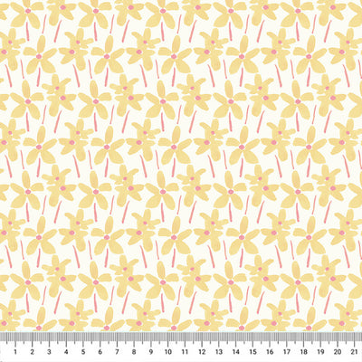 Hand-printed yellow summer daisies printed on a white quilting fabric with a cm ruler.