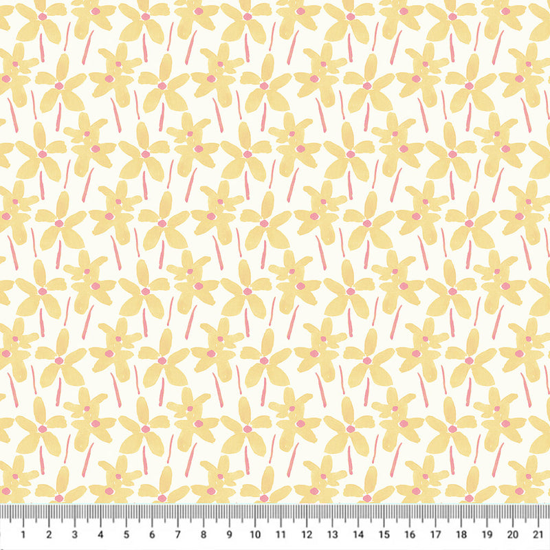 Hand-printed yellow summer daisies printed on a white quilting fabric with a cm ruler.