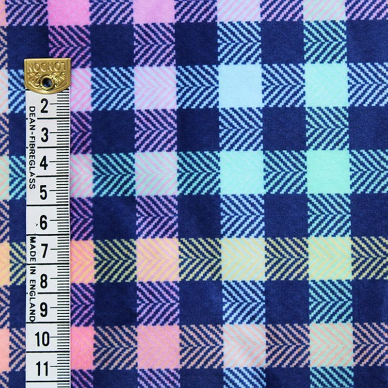 Bubs sherpa fleece printed with a colourful check with a cm ruler