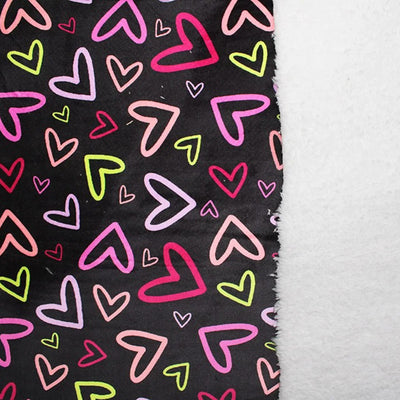 Black fleece with colourful hearts back with a white sherpa fleece