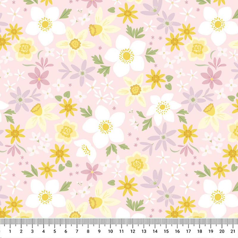 Daffodils printed on a pale pink cotton fabric by Lewis & Irene with a cm ruler