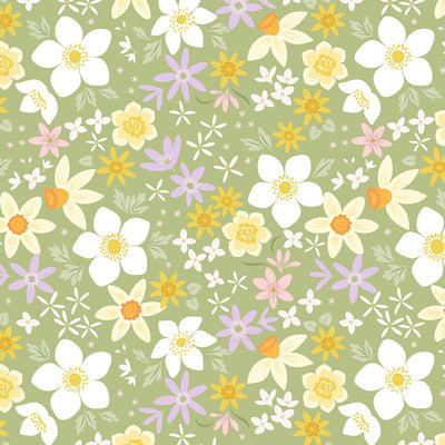 Daffodil flowers in white yellow and purple on a gorgeous spring green to create a colourful sense of spring.