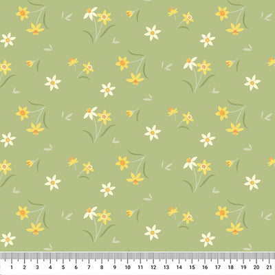 Sunshine yellow daffodils on a pretty mossy green background printed on cotton fabric with a cm ruler