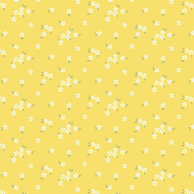 A delicate print of white daisies bunched on a gorgeous, bright yellow cotton fabric.