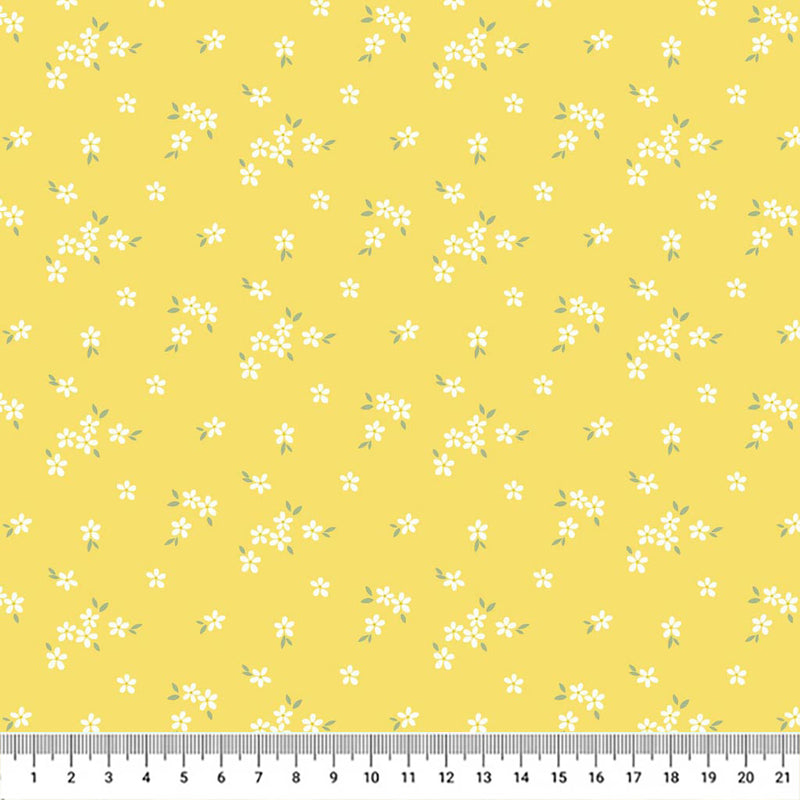 A delicate print of white daisies bunched on a gorgeous, bright yellow cotton fabric with a cm ruler