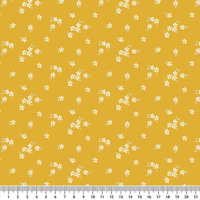 A delicate print of white daisies bunched on a gorgeous, deep orange cotton fabric with a cm ruler