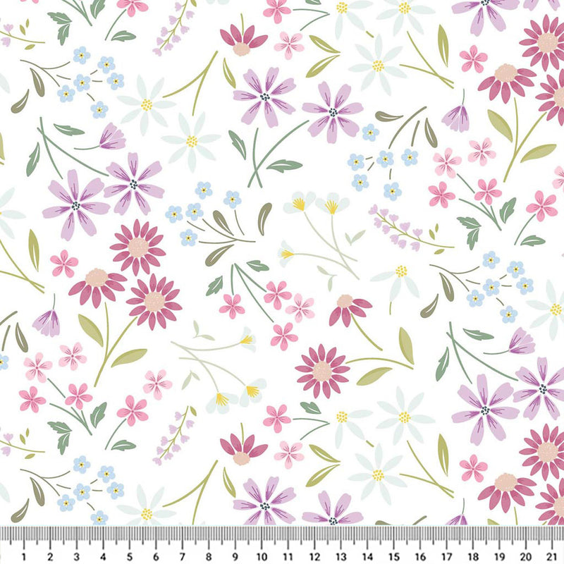 Pressed flowers printed on a white cotton quilting fabric by Lewis & Irene with a cm ruler