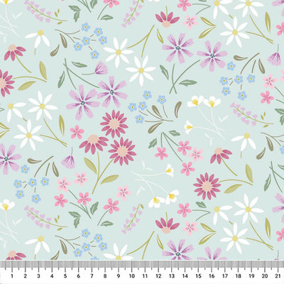 Pressed flowers printed on a light teal cotton quilting fabric by Lewis & Irene with a cm ruler