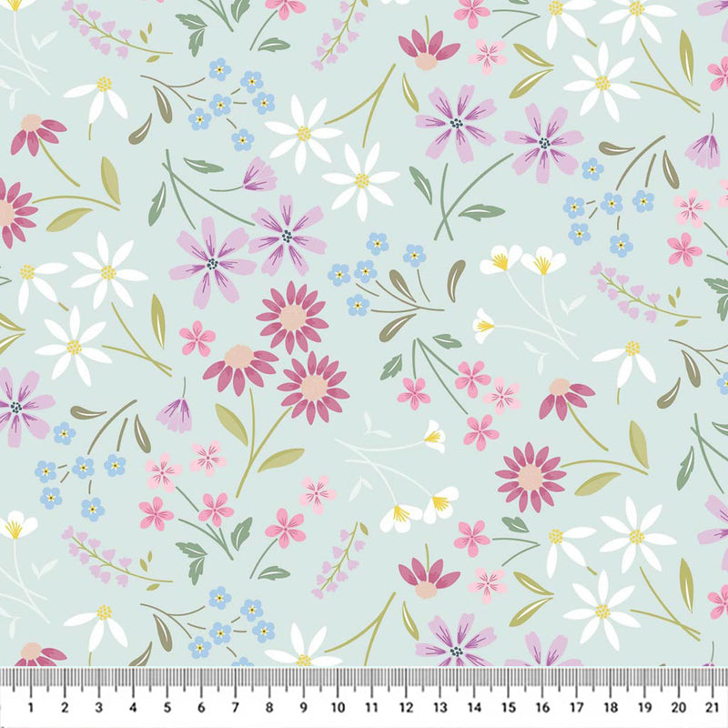 Pressed flowers printed on a light teal cotton quilting fabric by Lewis & Irene with a cm ruler