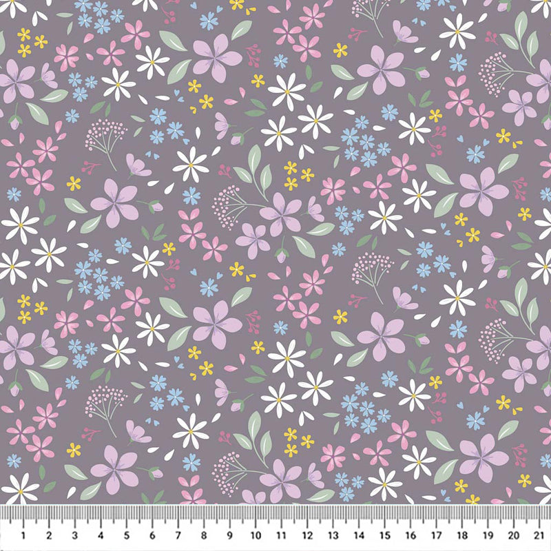 Pressed flowers printed on a grey cotton quilting fabric with a cm ruler