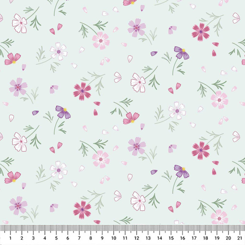 Flowers printed on a pale teal cotton quilting fabric by Lewis & Irene with a cm ruler