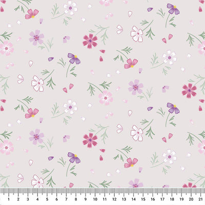 Flowers printed on a silver cotton quilting fabric by Lewis & Irene with a cm ruler