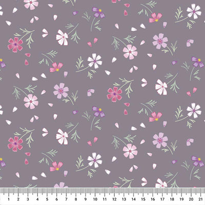 Flowers printed on a grey cotton quilting fabric by Lewis & Irene with a cm ruler