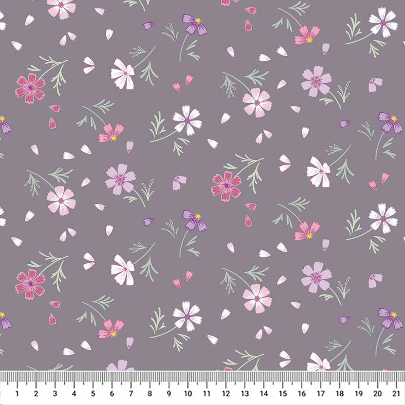 Flowers printed on a grey cotton quilting fabric by Lewis & Irene with a cm ruler