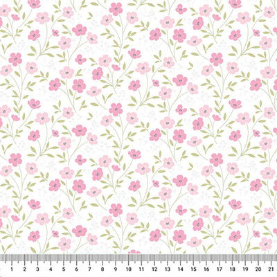 Blossoms printed on a white cotton quilting fabric by Lewis & Irene with a cm ruler