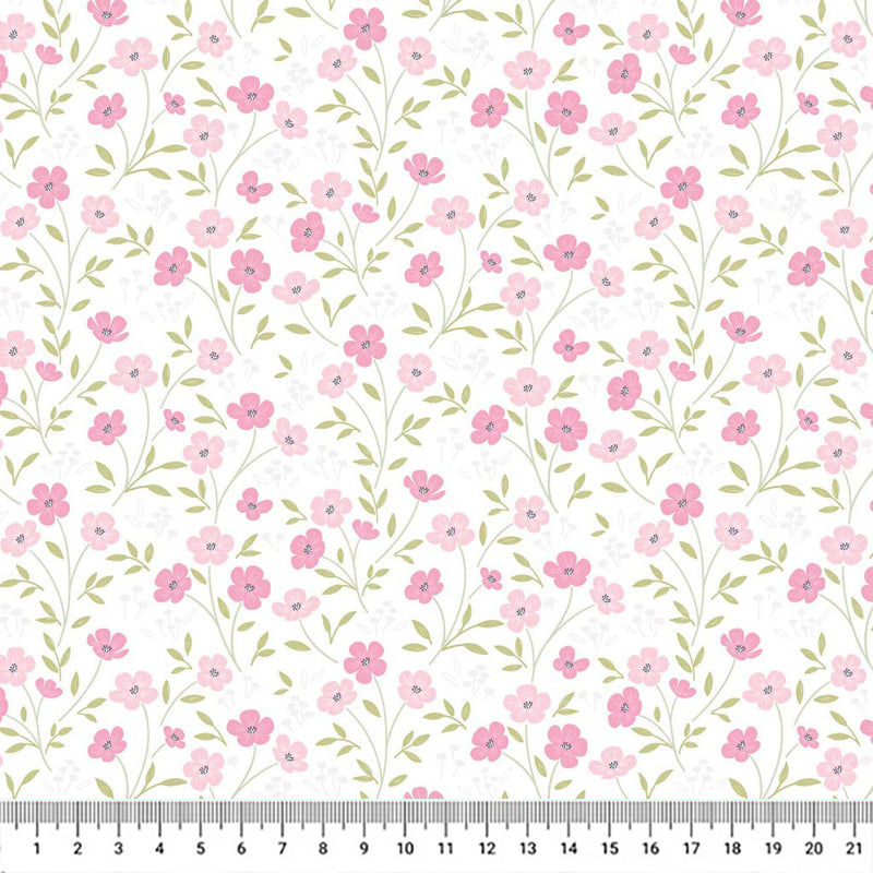 Blossoms printed on a white cotton quilting fabric by Lewis & Irene with a cm ruler