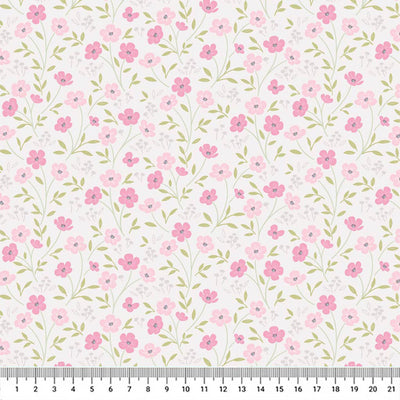 Blossoms printed on a light mink cotton quilting fabric by Lewis & Irene with a cm ruler