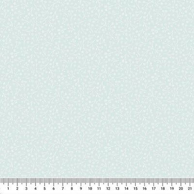 Ditsy flower printed on a light teal cotton quilting fabric by Lewis & Irene with a cm ruler