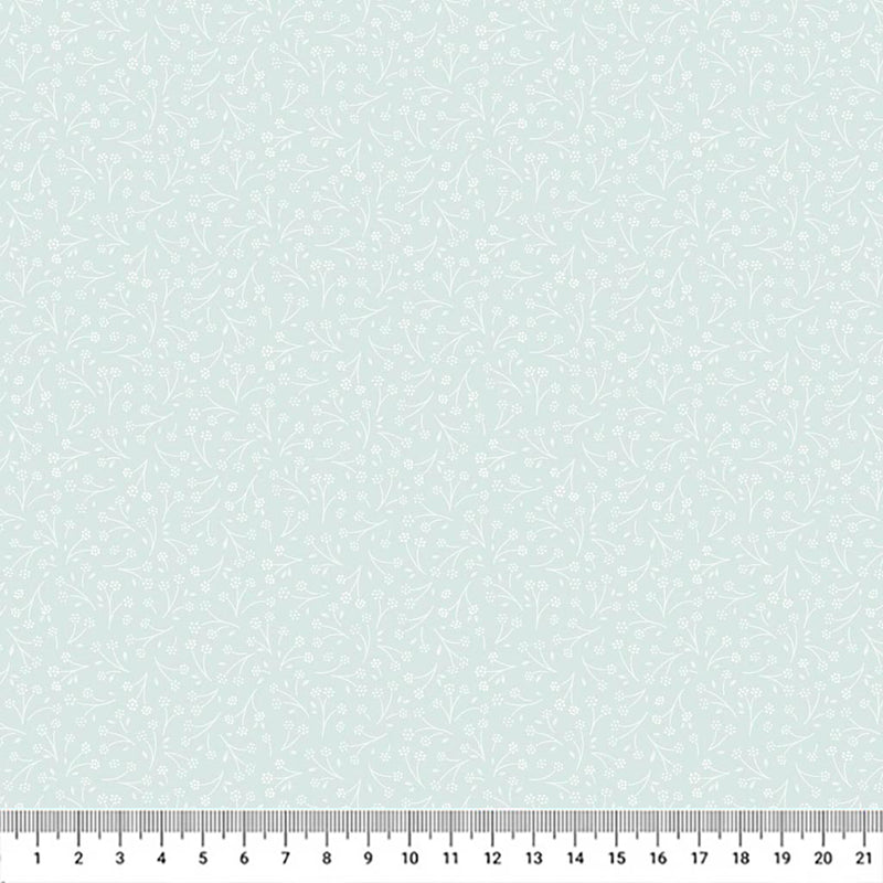 Ditsy flower printed on a light teal cotton quilting fabric by Lewis & Irene with a cm ruler