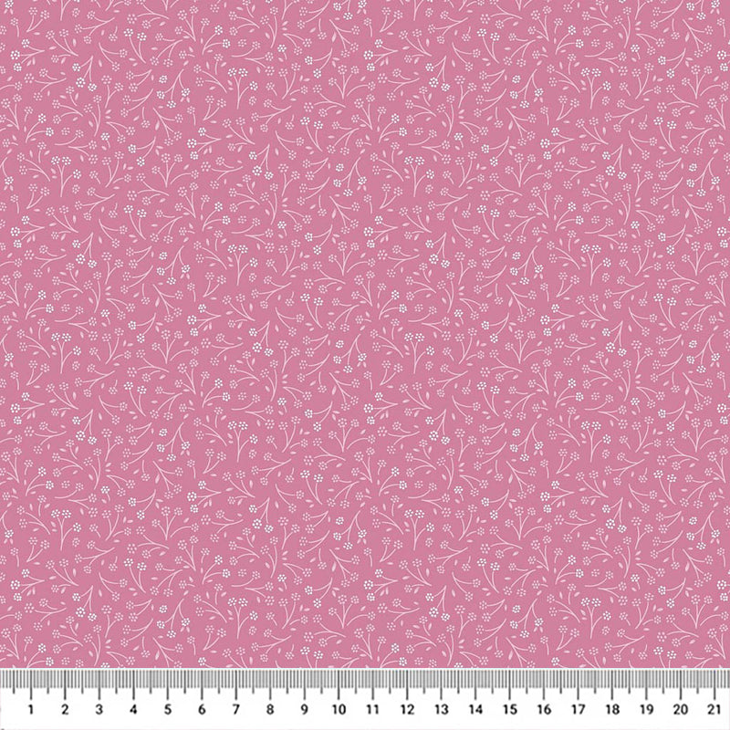 Ditsy flower printed on a cerise cotton quilting fabric by Lewis & Irene with a cm ruler