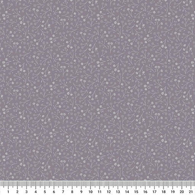 Ditsy flower printed on a charcoal grey cotton quilting fabric by Lewis & Irene with a cm ruler