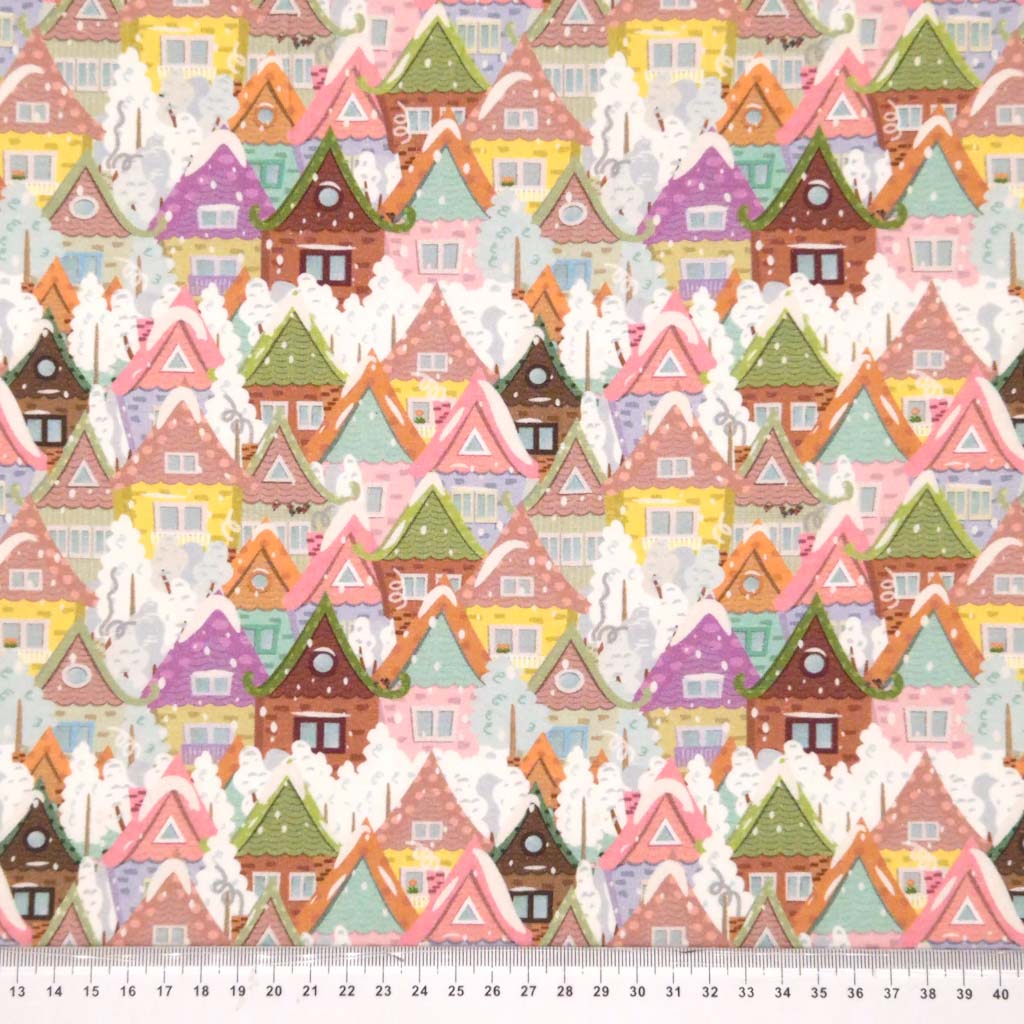 Festive cottages printed on a cotton jersey fabric with a cm ruler