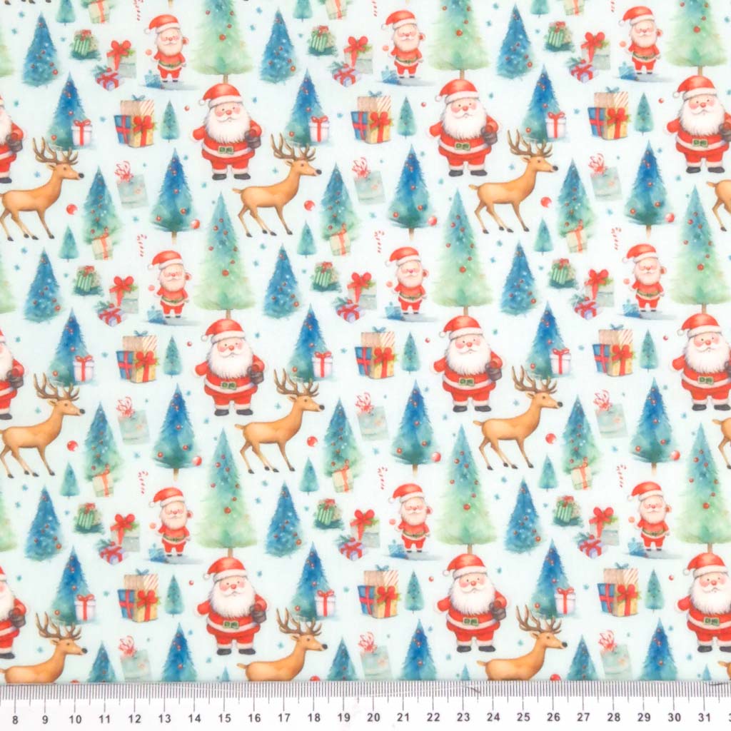 Santa and reindeer are printed on a blue christmas polycotton fabric with a cm ruler