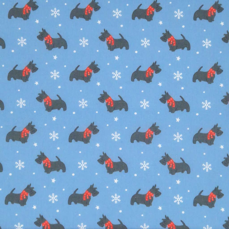 Schnauzer dogs printed on a blue christmas polycotton fabric