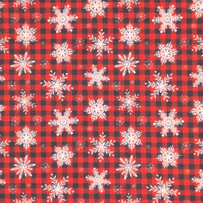 Snowflakes printed on a red and black check polycotton fabric