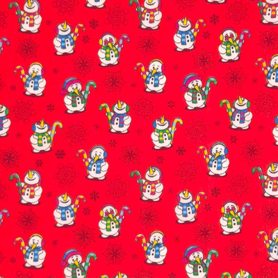 Festive snowmen printed on  red polycotton fabric