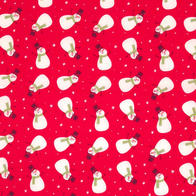 Festive snowmen printed on a red polycotton fabric