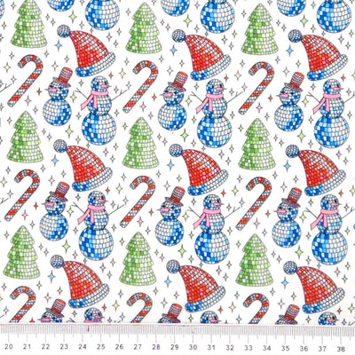 Pattern of disco balls, snowmen, candy canes, and trees on a white polycotton fabric.
