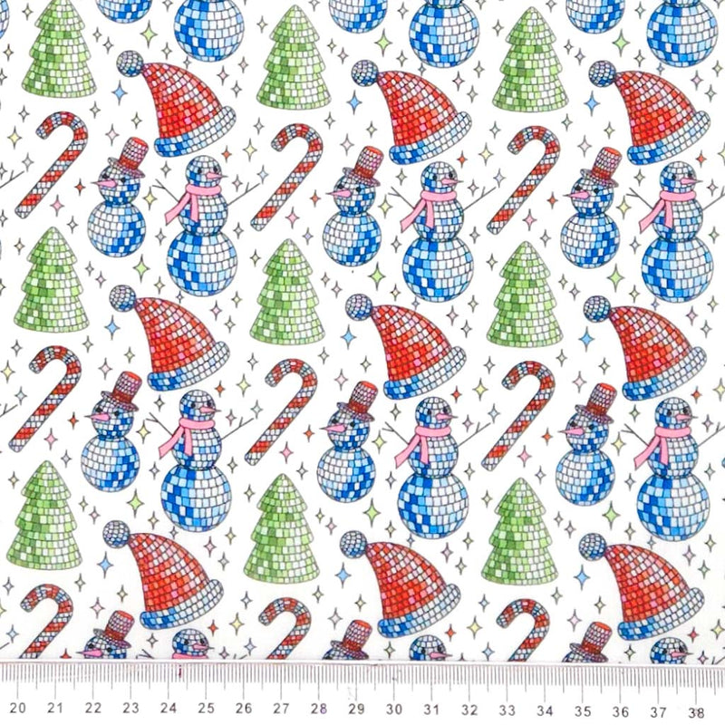 Pattern of disco balls, snowmen, candy canes, and trees on a white polycotton fabric.