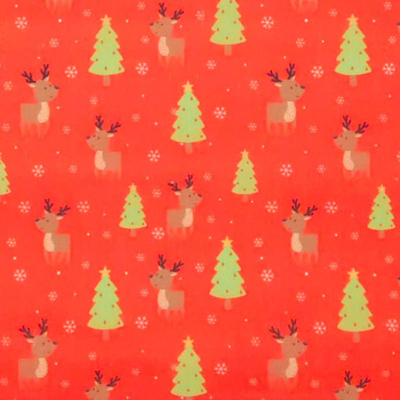 Pattern of reindeer, Christmas trees, and snowflakes on a red polycotton fabric