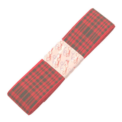 Red and green tartan fabric ribbon with a visible brand label on a white background