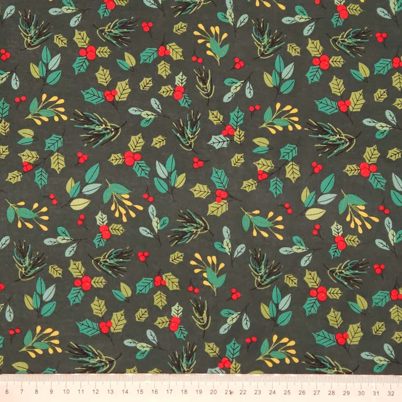 Festive fabric pattern with green leaves, red berries, and gold accents on a dark green cotton fabric