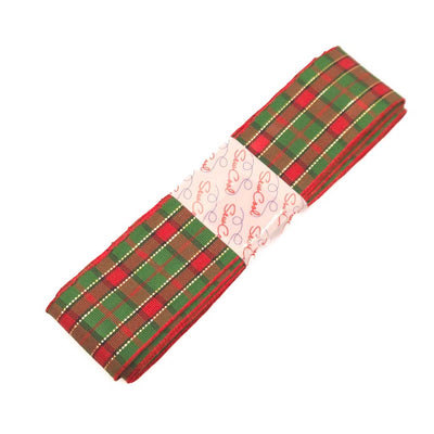 Red and green tartan ribbon with a white label on a white background